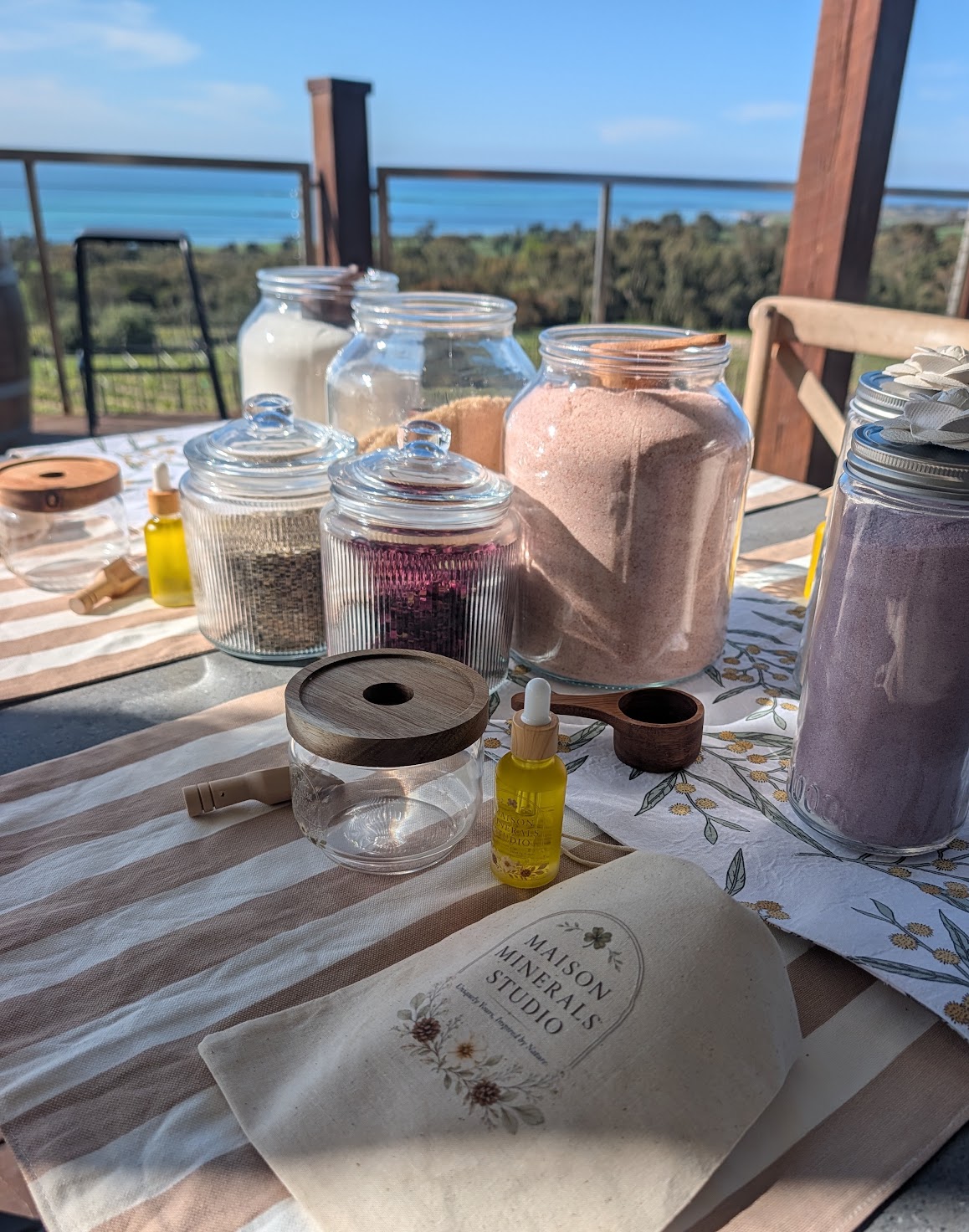 Blending bar set up in a private home or winery space, styled with timber and linen