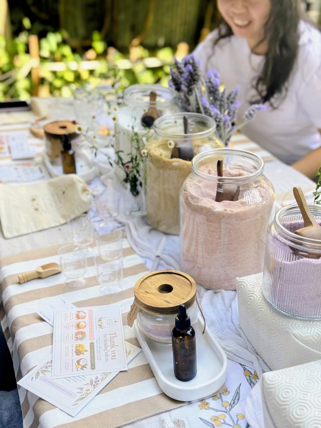 Flat lay of the full kit — jars, scoops, ingredient dishes, labels and linen laid out before guests arrive
